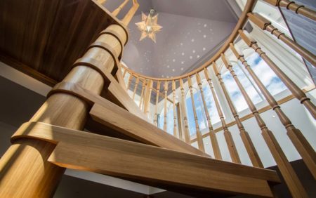 A view looking up at a Model 71 spiral staircase in Tilford