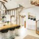 kitchen with breakfast bar with oak spiral staircase