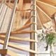 stainless steel centre column on a spiral stair with light wooden steps