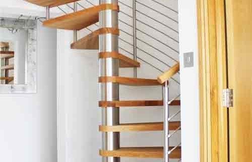 spiral staircase on grey floor with oak treads and open risers