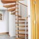 spiral staircase on grey floor with oak treads and open risers