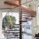 large spiral staircase in a showroom with tiled floor