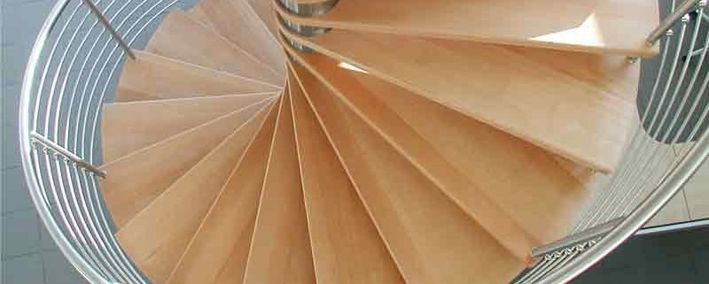 looking down on beech spiral staircase with stainless handrail