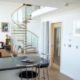 kitchen diner with breakfast bar and glass and oak spiral staircase