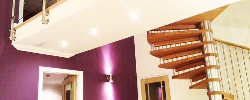 house with walkway with spiral staircase ascending