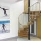 spiral stair with chunky walnut steps and stainless balustrade