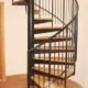 black spiral staircase with steel handrail and spindles with oak treads