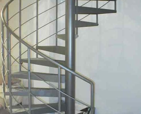 dark grey steel spiral staircase in a shop