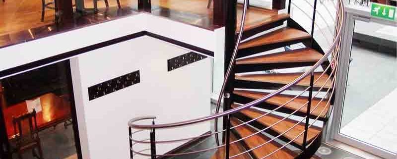 large black and wood spiral stair in a wine bar