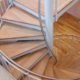 a steel and wooden spiral stair with timber flooring