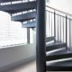 large centre column of a spiral staircase with steel steps