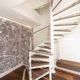 spiral stair in an estate agents in white and walnut