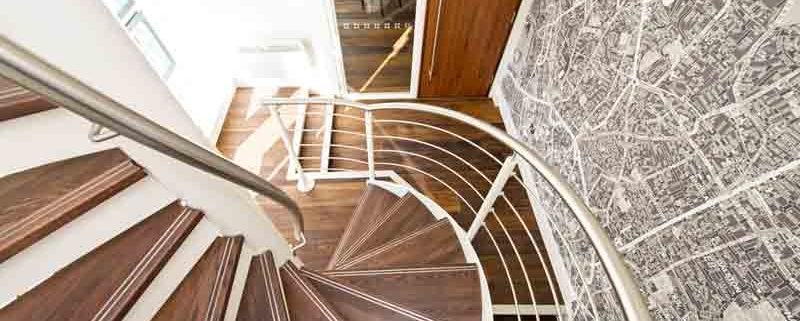 lower part of a timber spiral-Stair with stainless balustrade