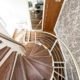 lower part of a timber spiral-Stair with stainless balustrade