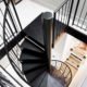 black spiral stair leading to a loft