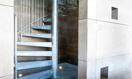galvanised internal spiral stair in a concreate shaft