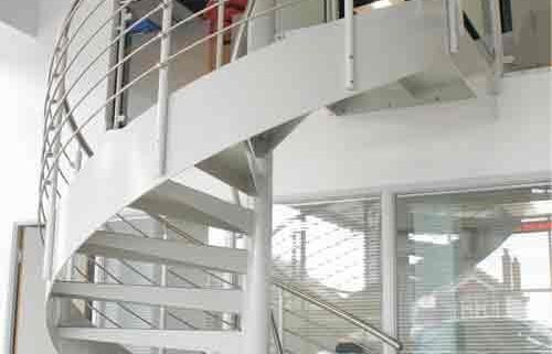 white steel spiral staircase with stringer