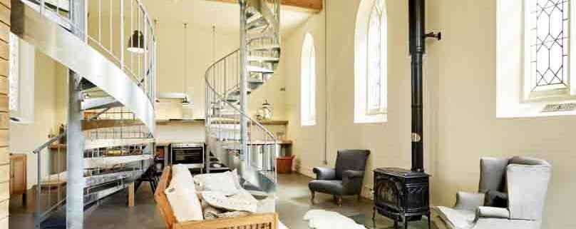 two galvnaised steel spirals ascending within a church conversion