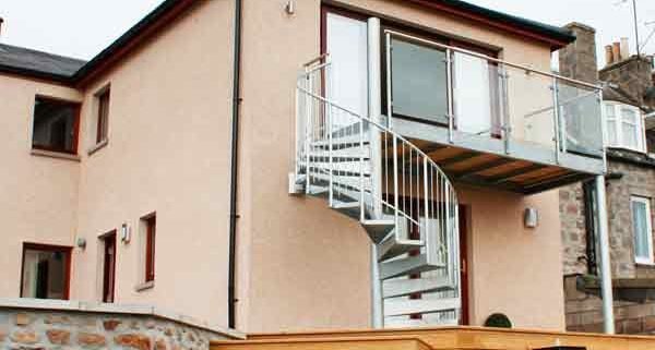 galvanised spiral stair and balcony to rear of house
