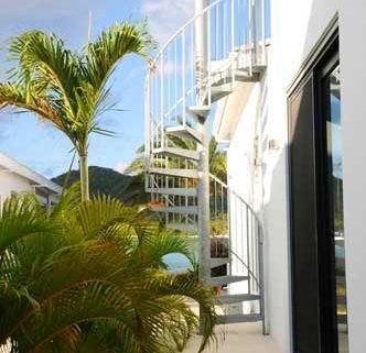 sky and sea to rear of an outdoor spiral staircase