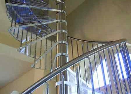 stainless steel spindles and handrail on a spiral stair with acrylic steps