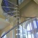 stainless steel spindles and handrail on a spiral stair with acrylic steps