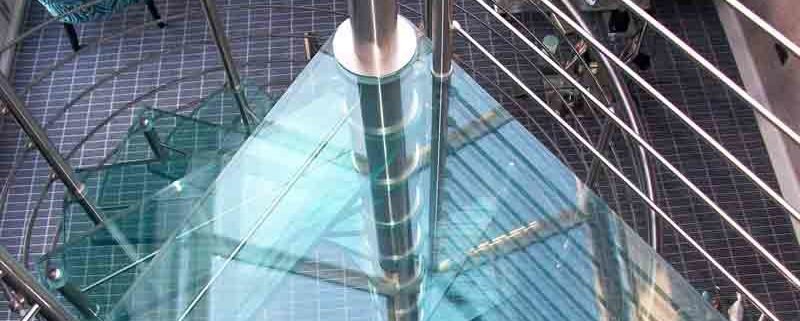 triangular top platform in glass with spiral stair below