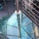 triangular top platform in glass with spiral stair below