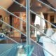 glass step on a spiral stair with stainless balustrade
