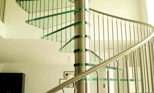 stainless steel spindles and handrail on spiral stair with glass steps