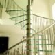 stainless steel spindles and handrail on spiral stair with glass steps