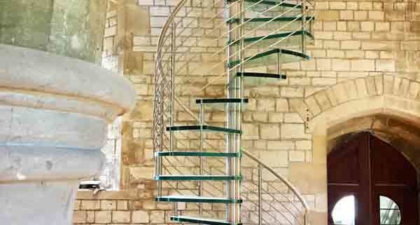 high spiral stair with glass steps in a church
