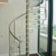 spiral stair with acrylic steps and stainless handrail