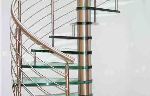 glass spiral stair set in curved wall