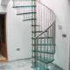 glass spiral stair with uplights