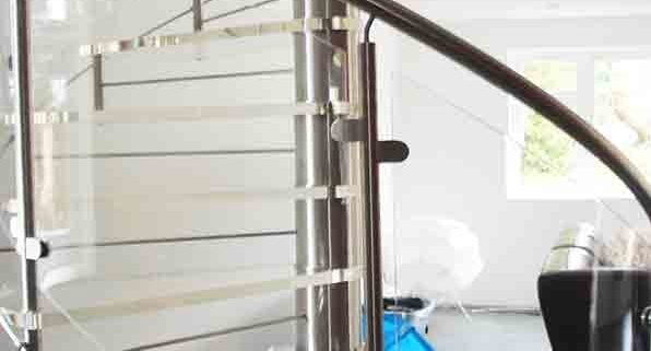 curved acrylic glass panels on modern spiral staircase