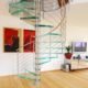 modern living room with wooden floor and glass spiral staircase