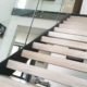 close up of open riser staircase with light wooden steps