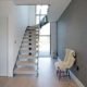light wooden floor with modern stair rising Infront of window