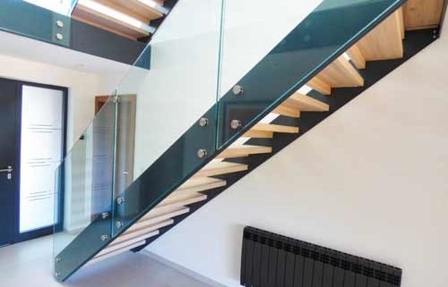 straight dark grey steel staircase with frameless glass