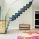 hallway with grey steel and wood staircase