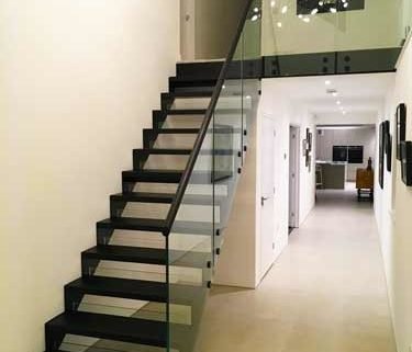 black open riser modern stair in a house
