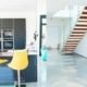 polished concreate floor in a house with kitchen and modern open stair