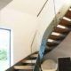 modern open riser stair with wooden steps and glass panels