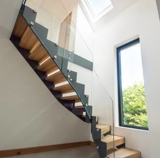 tiled floor with steel stringer staircase with glass panels