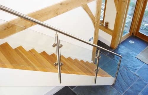 white steel staircase with glass balustrade