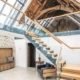barn conversion with glass balustrade on a mezzanine level