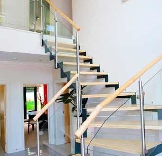 zig zag dark steel stringers with light wooden steps and open risers