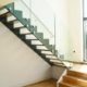 modern open riser stair with timber floor below
