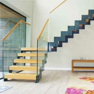 glass balustrade on a steel and wood stair